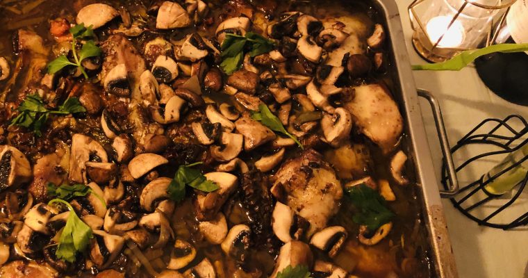 Coq au vin met champignons en cognac